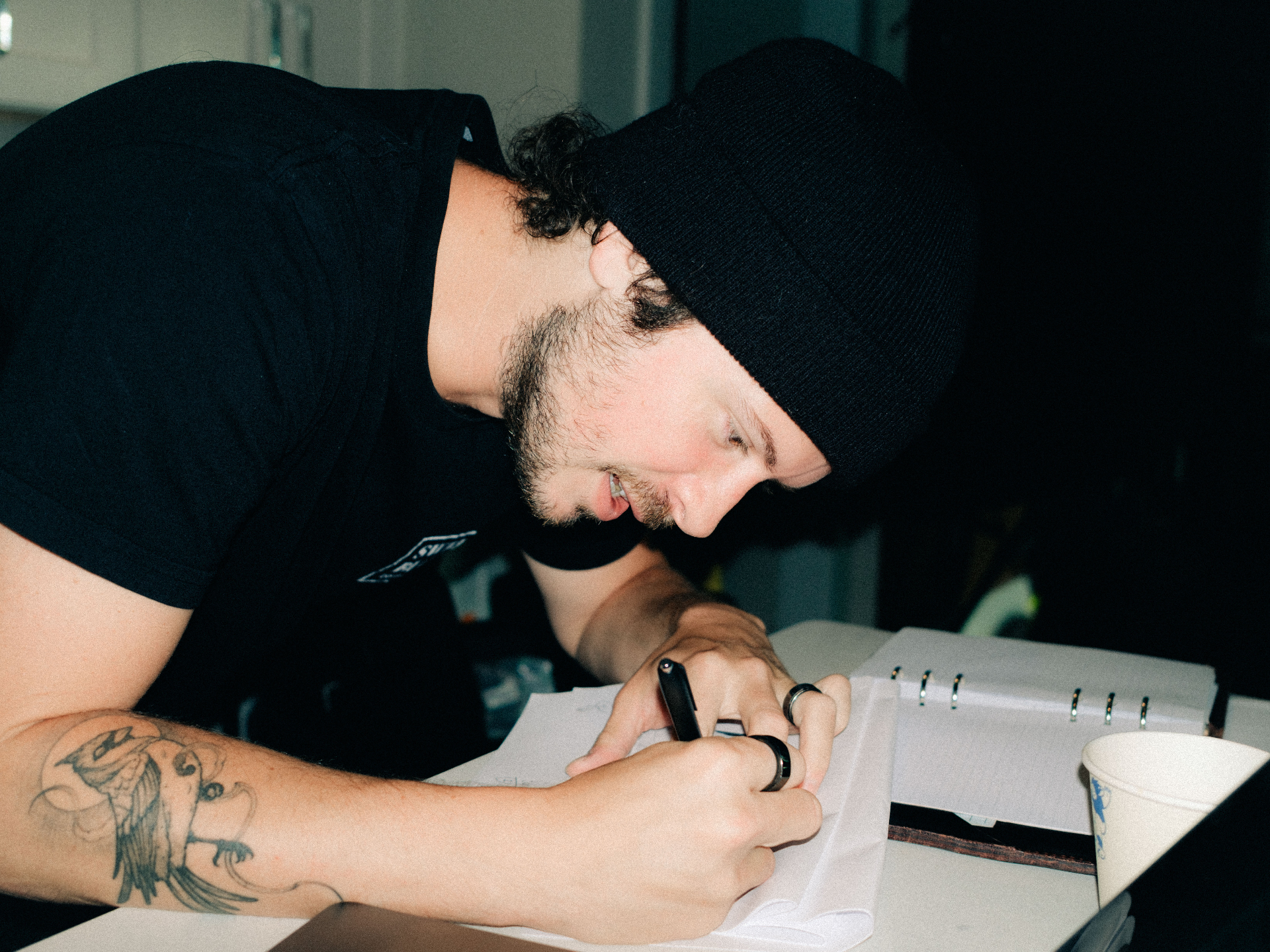Hudson Hower sketching shot list on set