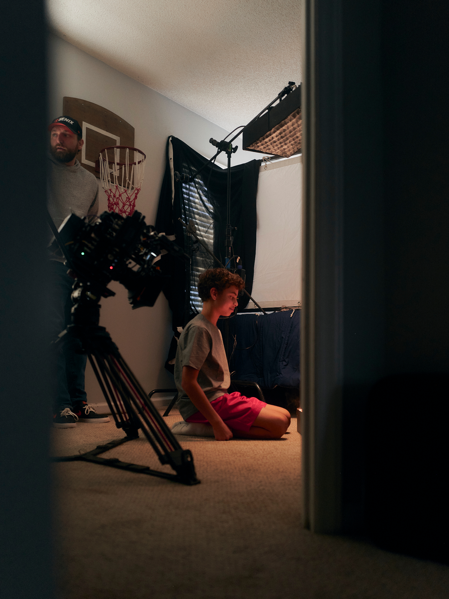 Rack Room BTS — bedroom scene through doorway